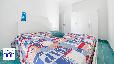 zoom dettaglio: 1_11_casa-vacanze-blumarine-portocesareo-camera-da-letto-matrimoniale.jpg